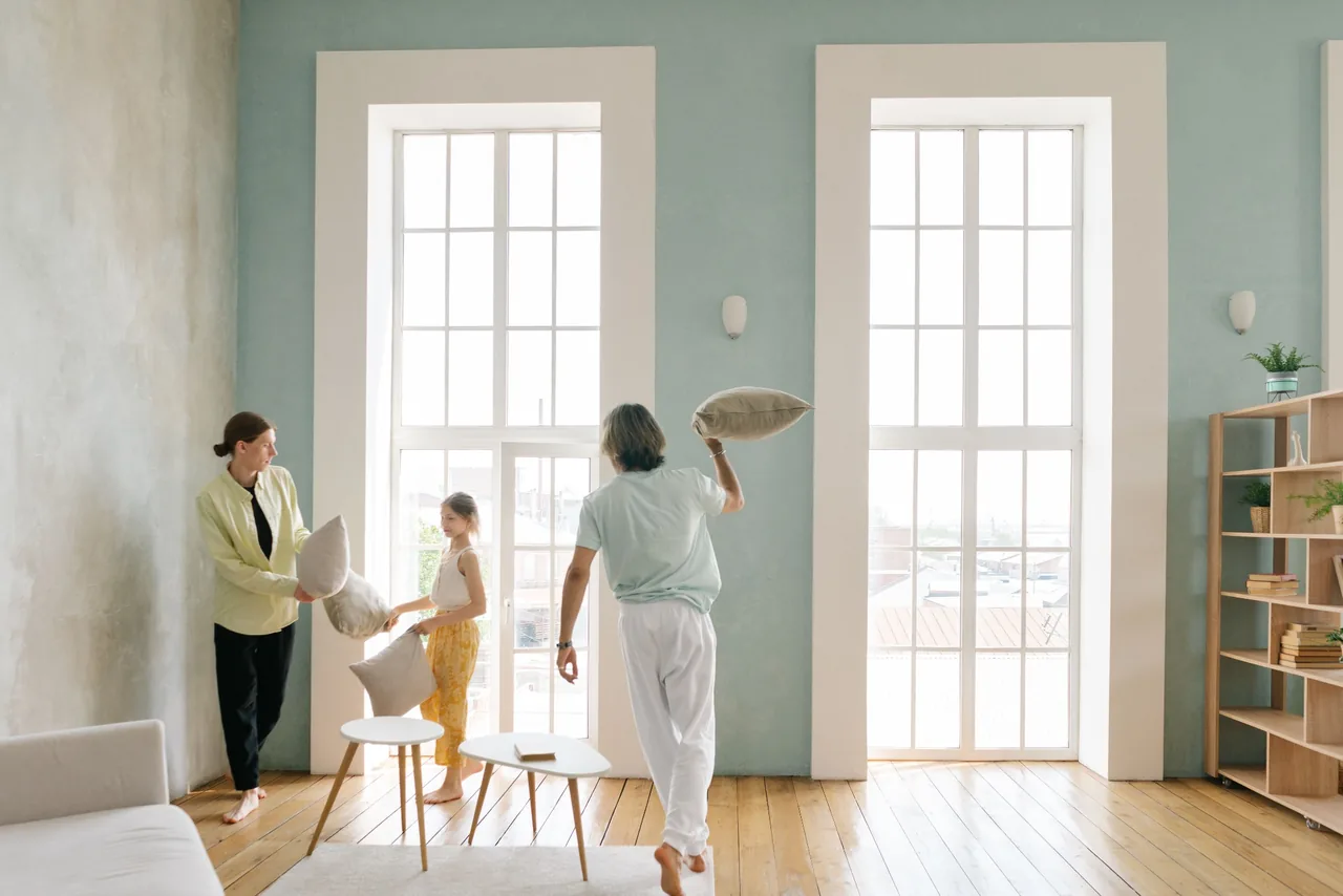 Family reviewing mortgage documents and borrower qualifications before choosing a credit union or broker
